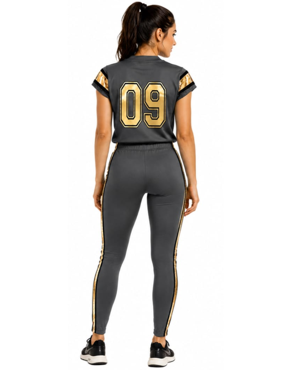 A woman shown from the back wearing a dark gray athletic set consisting of a short-sleeve crop top and matching leggings, both with gold and white stripe details and the number 09 on the back, against a plain white background.