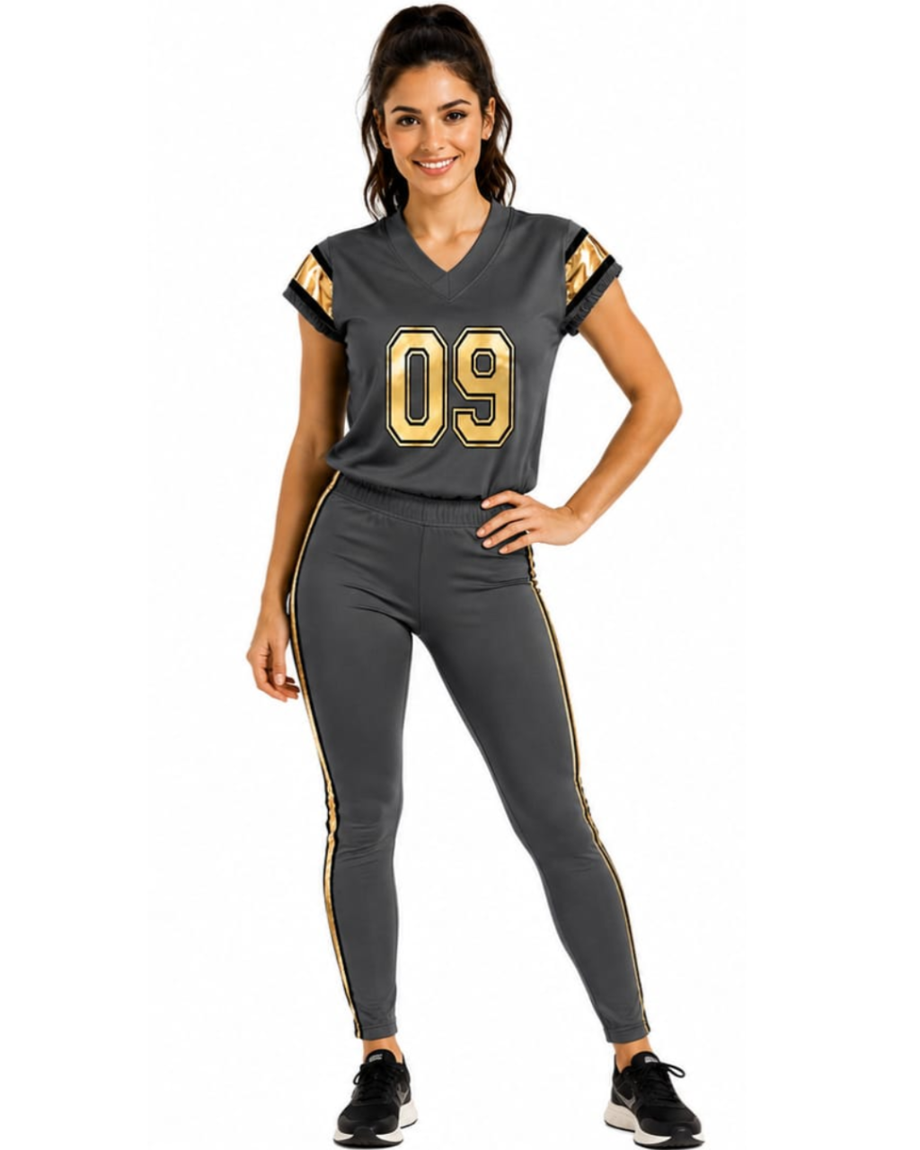 A woman modeling a dark gray athletic football-style jersey with gold trim and the number 09, paired with matching dark gray leggings with gold side stripes, against a plain white background.