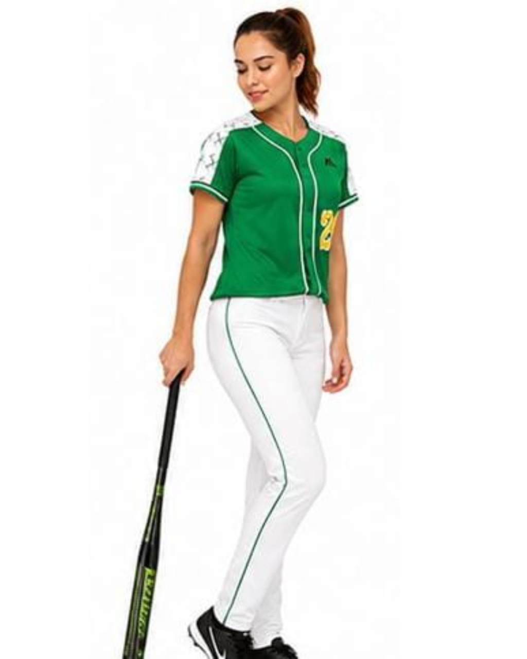 A woman modeling a green and white softball uniform with white pants featuring green side stripes, holding a black and green baseball bat against a plain white background.