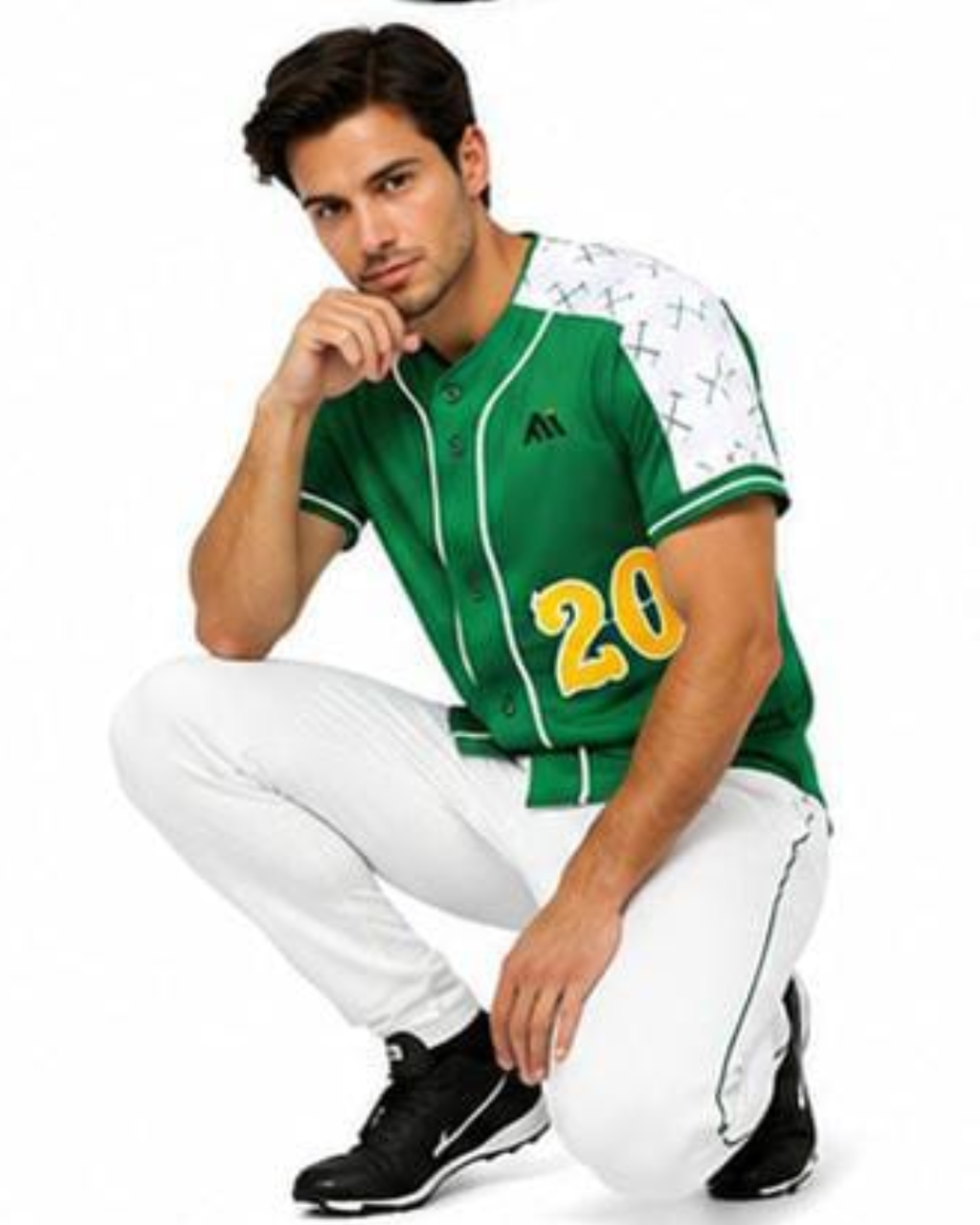 A man wearing a green and white baseball jersey with the number 20 on the front, paired with white pants and black sneakers, crouching against a white background.