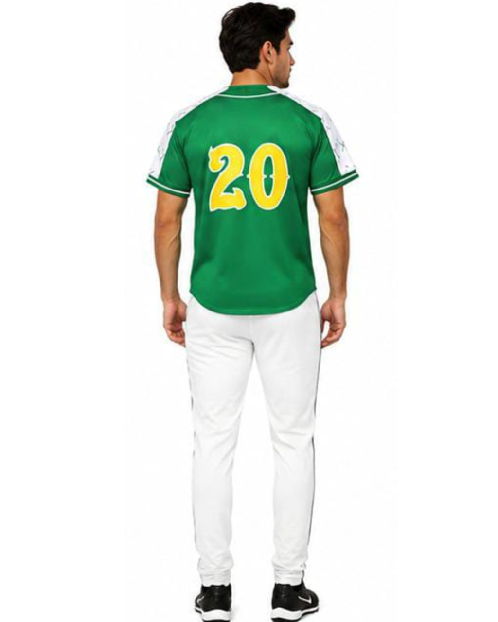 A man viewed from the back wearing a green short-sleeve sports jersey with white shoulder panels, white trim, and the number 20 in yellow on the back, paired with white pants and black sneakers, against a plain white background.