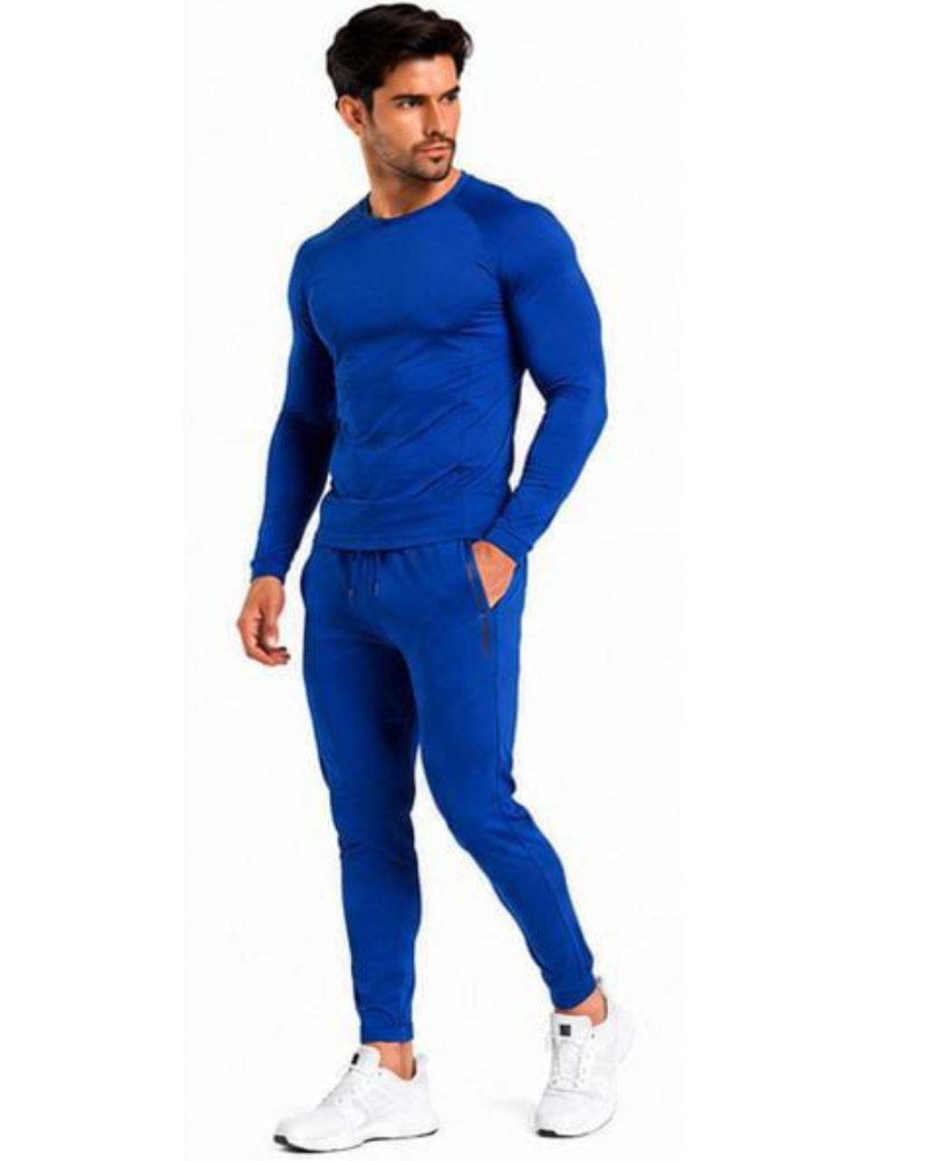 A man modeling a matching royal blue long-sleeve athletic top and jogger pants set, paired with white sneakers, against a plain white background.