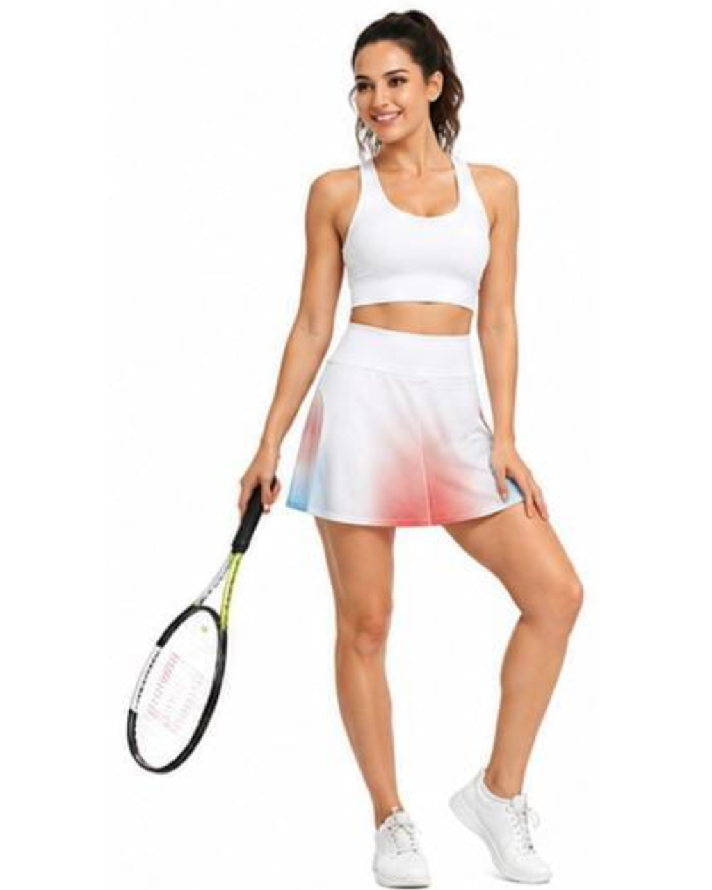 A woman modeling a white athletic set consisting of a sports bra and a high-waisted skort with a pink and blue gradient hem, holding a tennis racket against a plain white background.