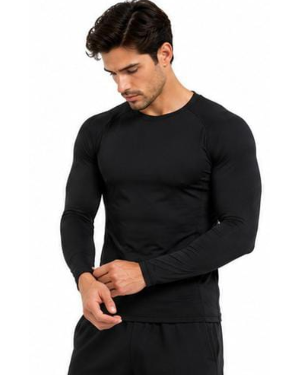 A man wearing a black long-sleeve athletic shirt and matching black pants, shown against a plain white background.
