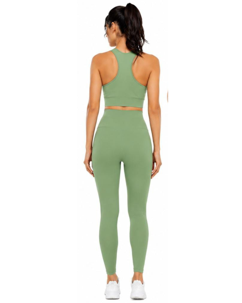 A woman shown from the back wearing a matching sage green activewear set consisting of a sports bra and high-waisted leggings, paired with white sneakers on a solid white background.
