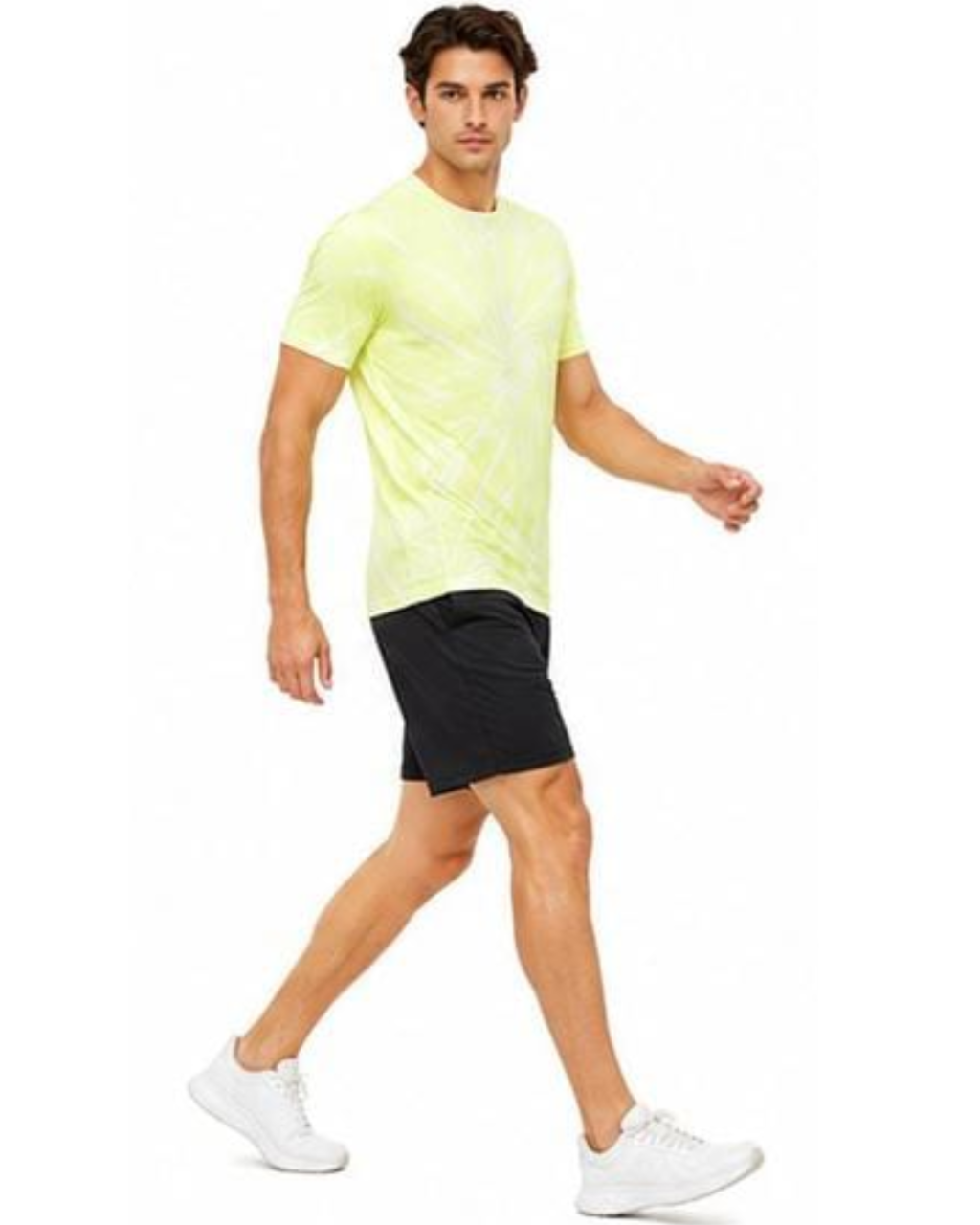 A man wearing a neon yellow-green athletic t-shirt, black athletic shorts, and white sneakers, captured in a side-profile walking pose against a solid white background.