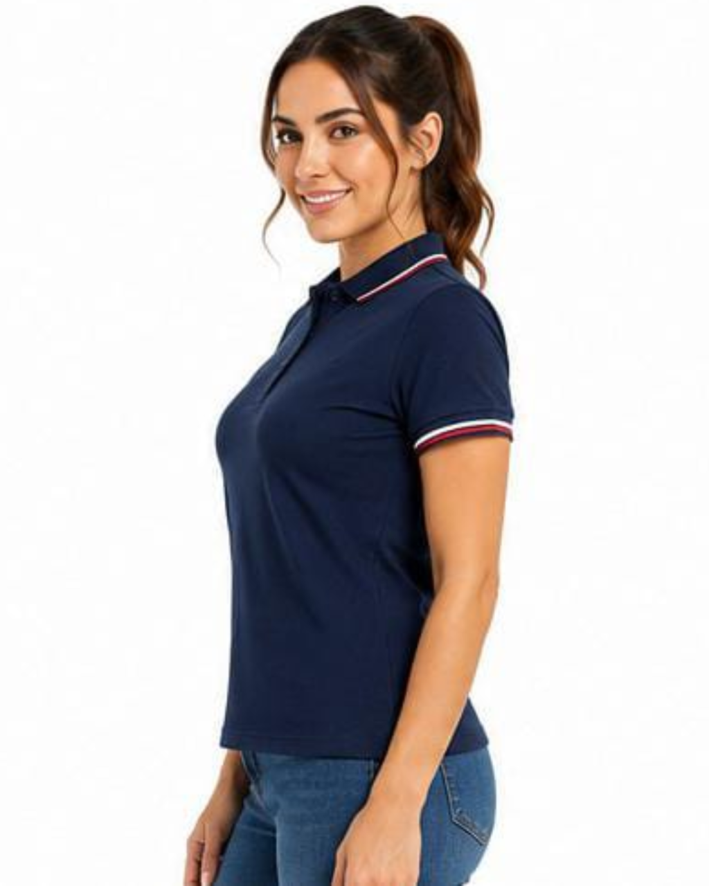 A woman wearing a navy blue short-sleeve polo shirt with white and red striped trim on the collar and sleeve cuffs, paired with blue jeans, set against a plain white background.
