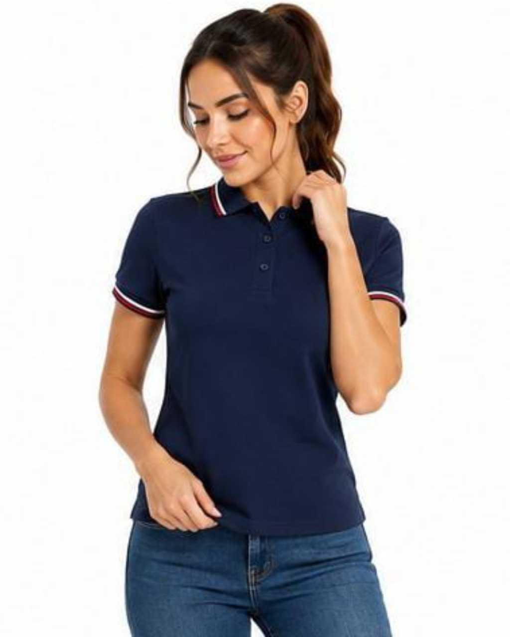 A woman wearing a navy blue short-sleeve polo shirt with white and red striped trim on the collar and sleeve cuffs, paired with blue jeans, against a plain white background.