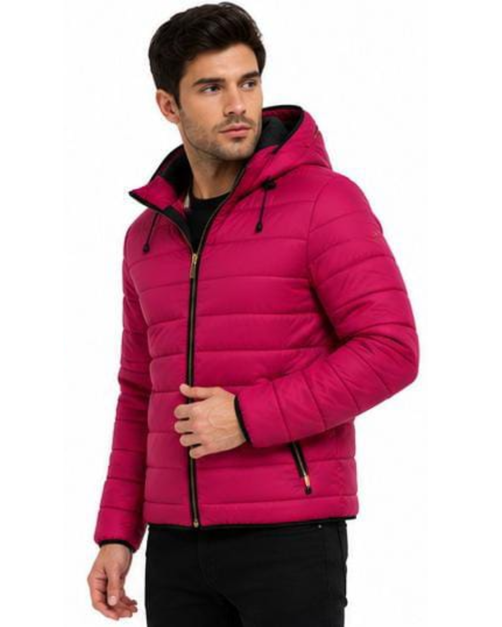 A man wearing a bright pink hooded puffer jacket with black trim and a black zippered front, paired with black pants, against a plain white background.