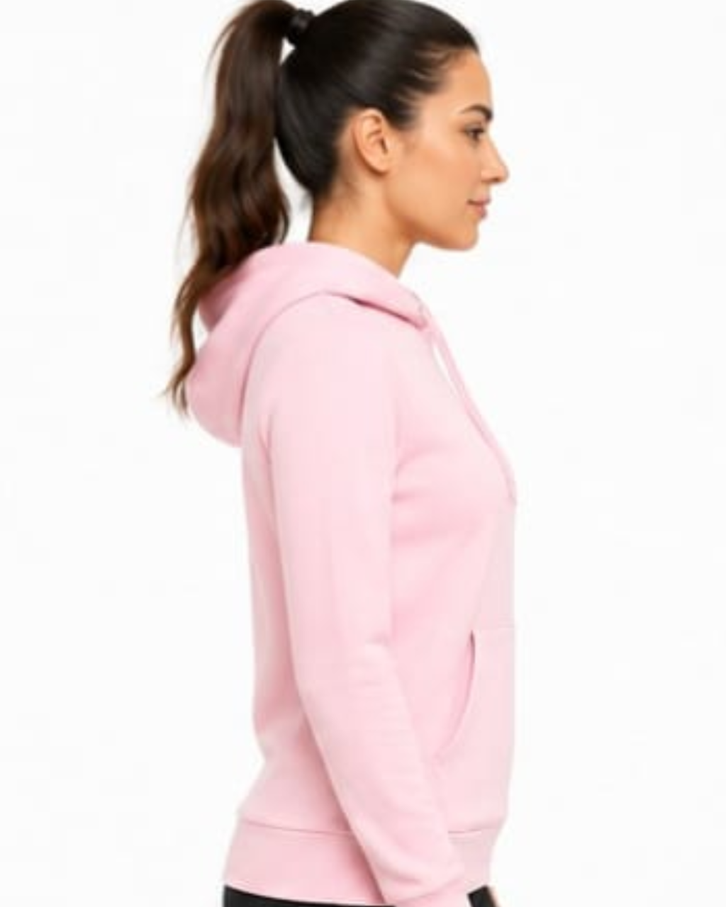 A woman in profile wearing a light pink pullover hoodie against a plain white background.