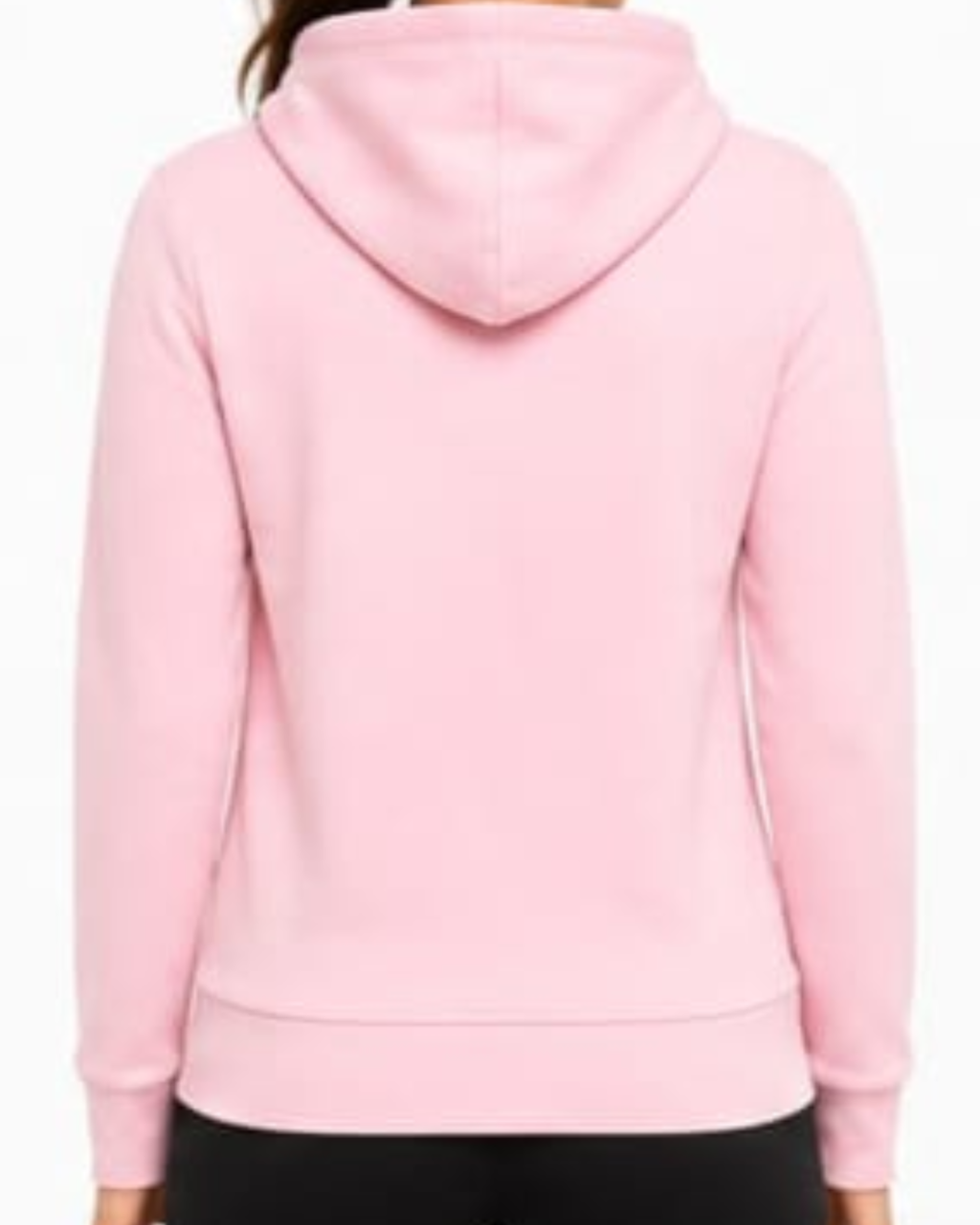 A person viewed from the back wearing a light pink pullover hoodie with black bottoms, against a plain white background.