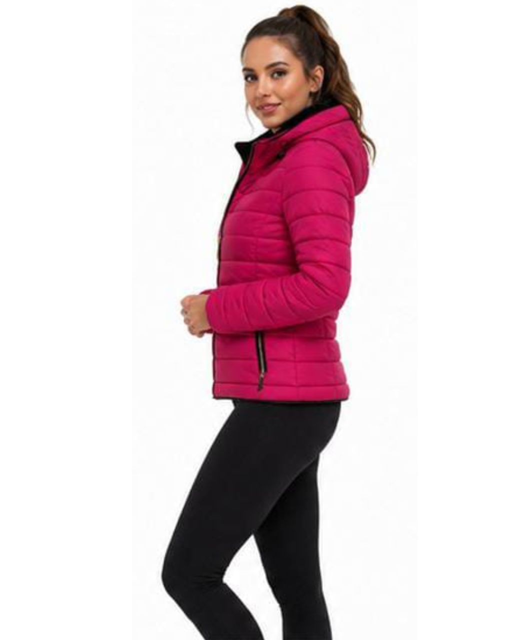 A woman modeling a bright pink hooded puffer jacket with black trim and black leggings, shown against a plain white background.