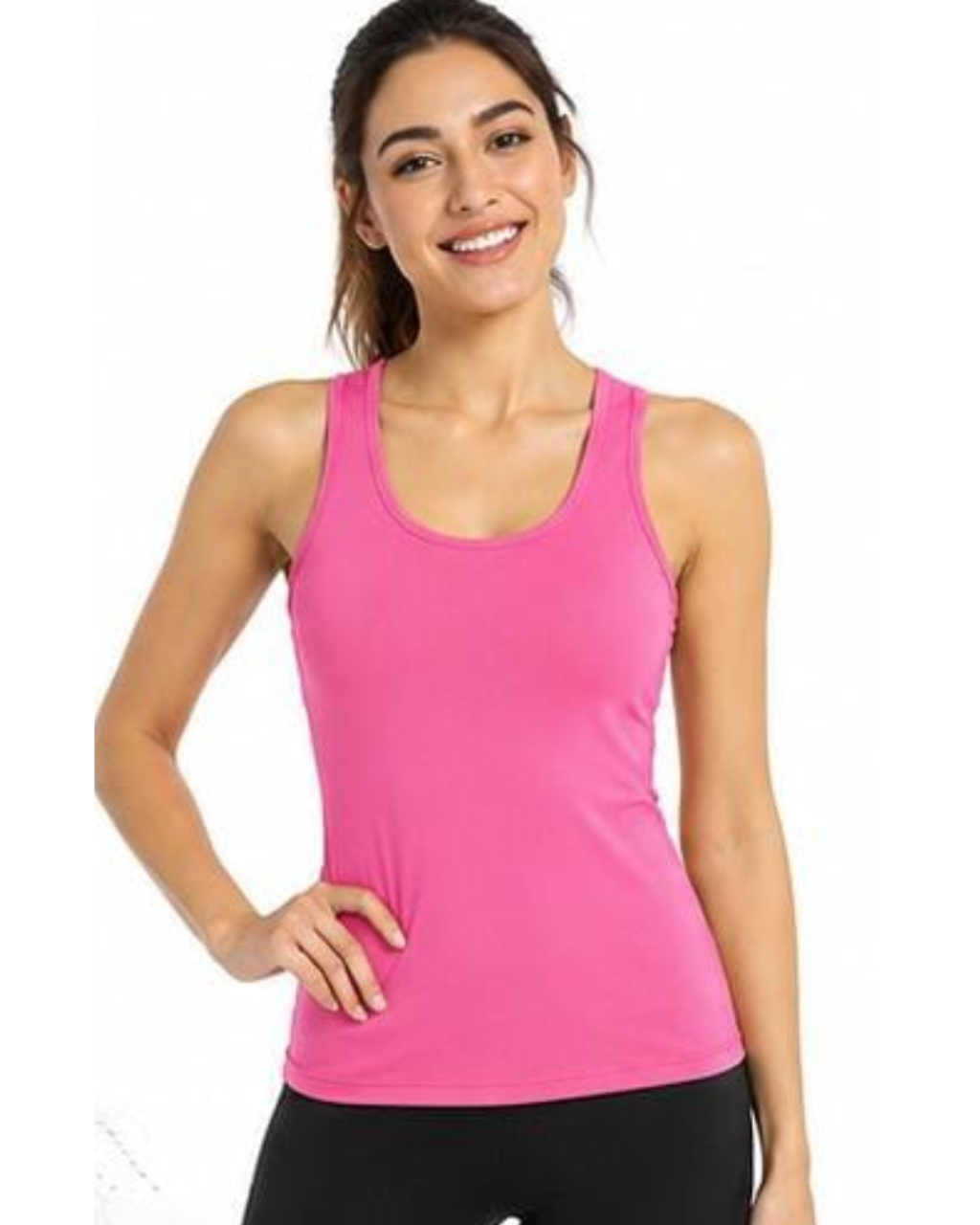 A woman modeling a bright pink racerback tank top against a plain white background.