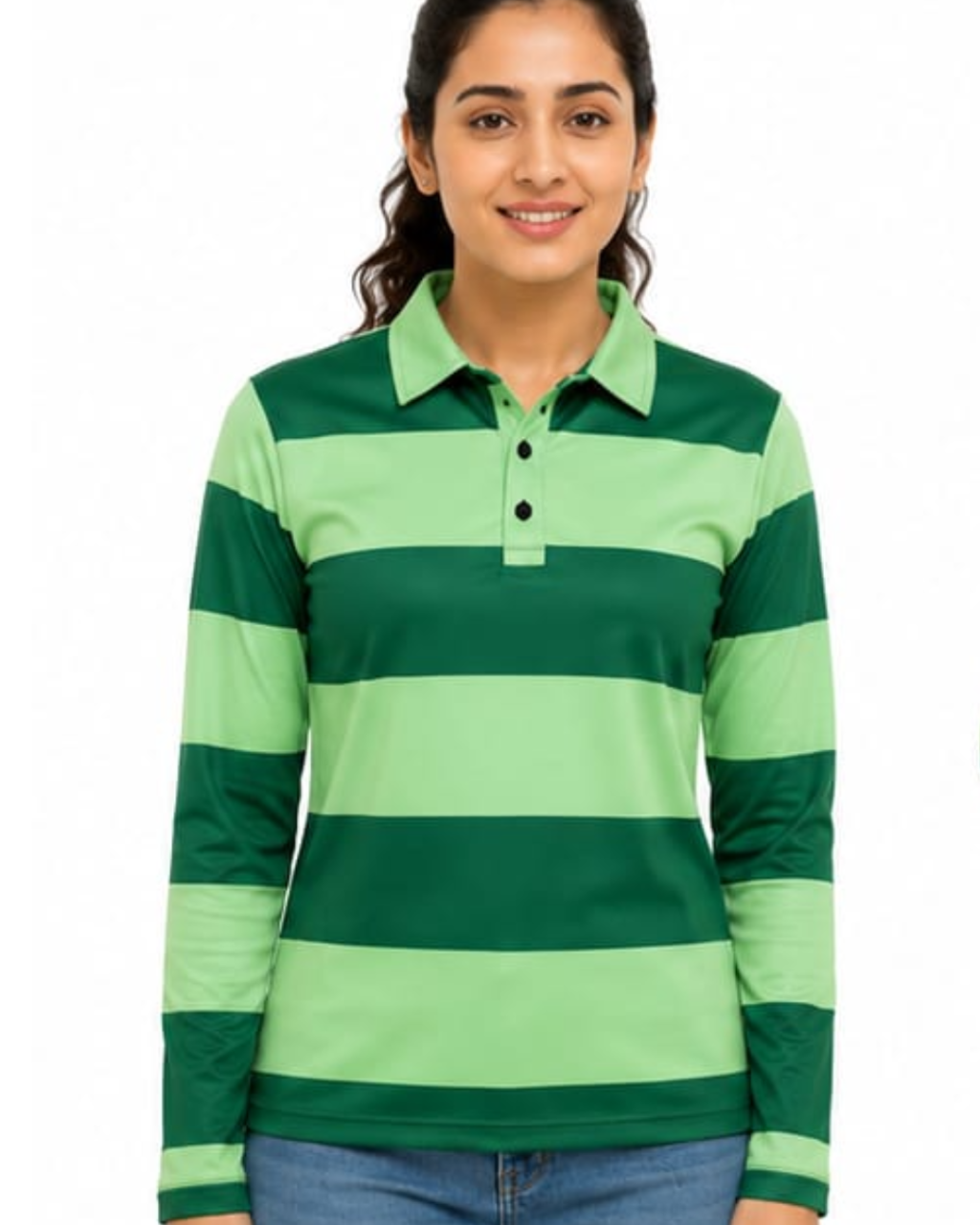 A woman wearing a green and light green horizontally striped long-sleeve polo shirt, paired with blue jeans, against a plain white background.