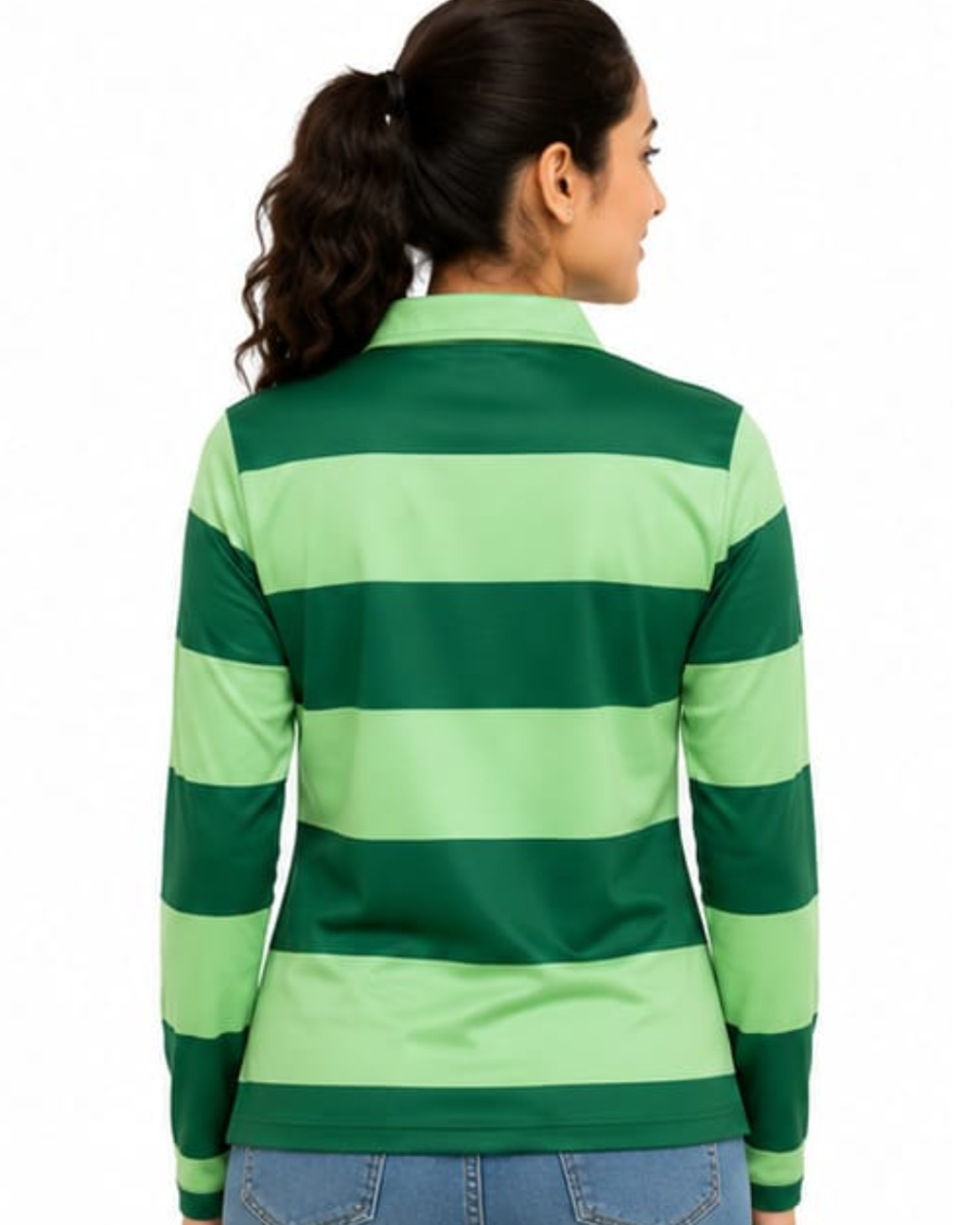 A woman shown from the back wearing a green and light green horizontally striped long-sleeve top, paired with blue jeans, against a plain white background.