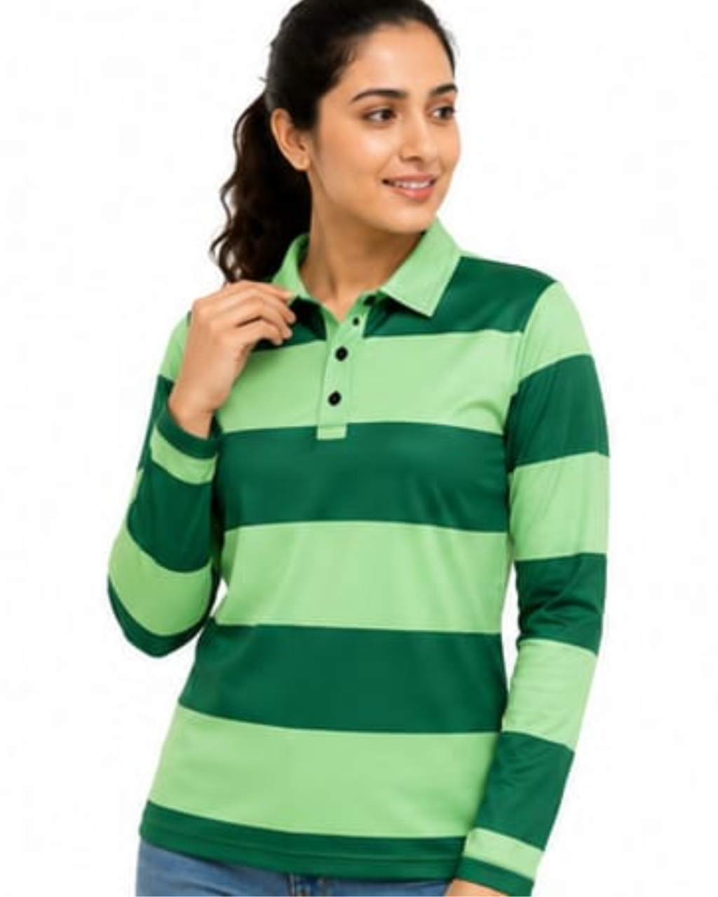 A woman wearing a green and light green horizontally striped long-sleeve polo shirt, paired with blue jeans, against a plain white background.
