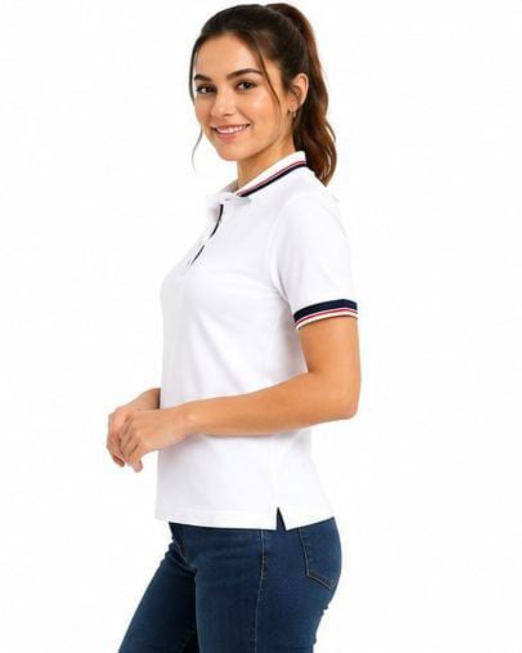 A woman wearing a white short-sleeve polo shirt with navy and red striped trim on the collar and sleeve cuffs, paired with dark blue jeans, photographed against a plain white background.