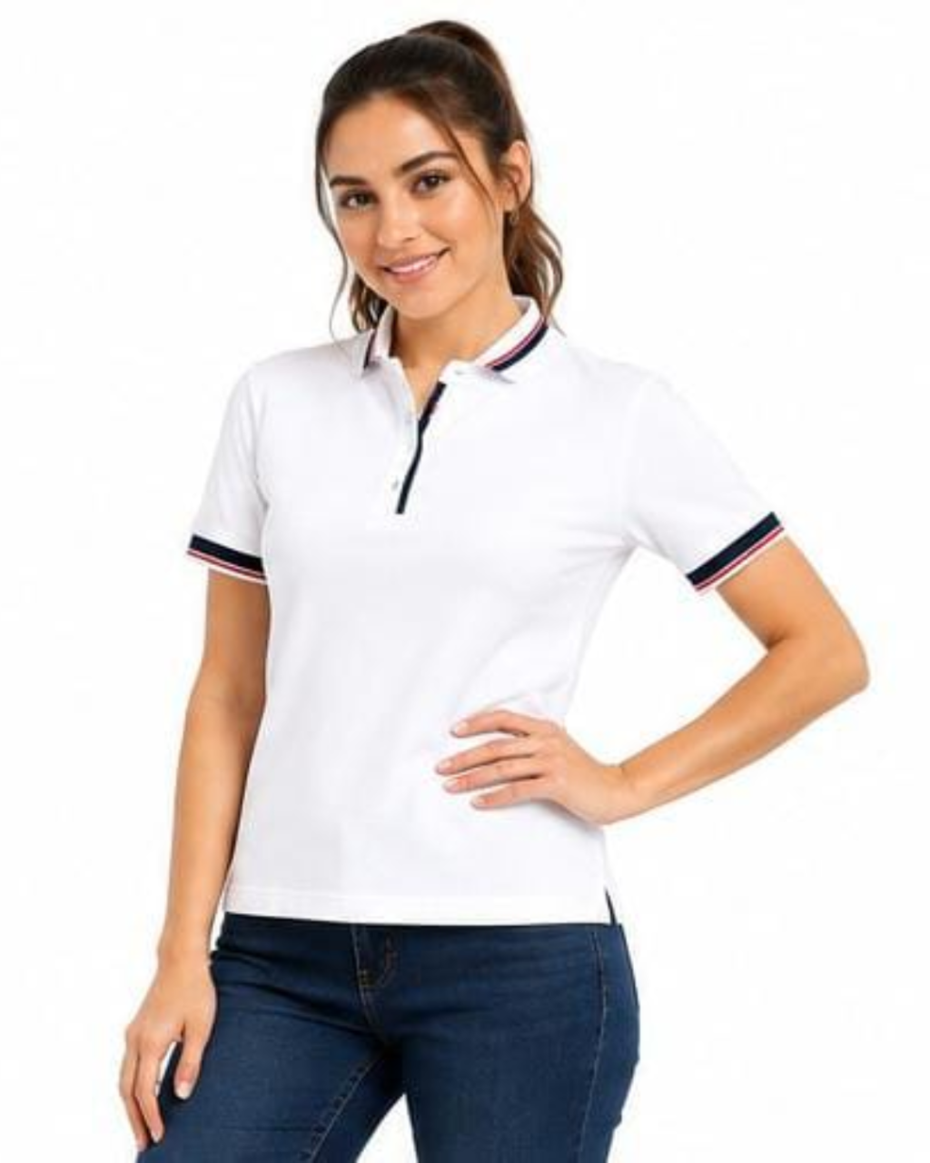 A woman modeling a white short-sleeve polo shirt with navy and red striped trim on the collar and sleeve cuffs, paired with dark blue jeans against a plain white background.