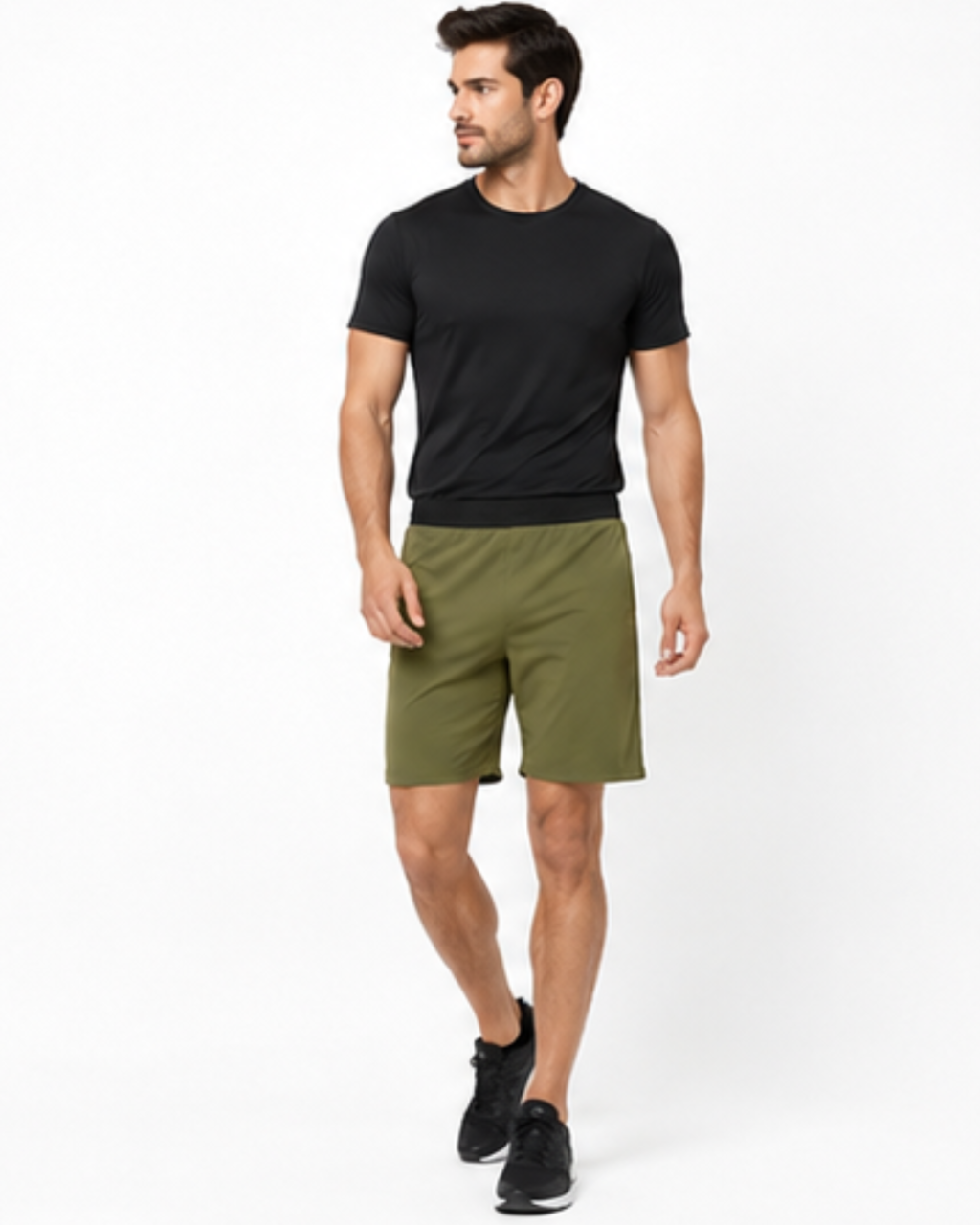 A man modeling a black short-sleeve athletic t-shirt and olive green shorts against a plain white studio background.