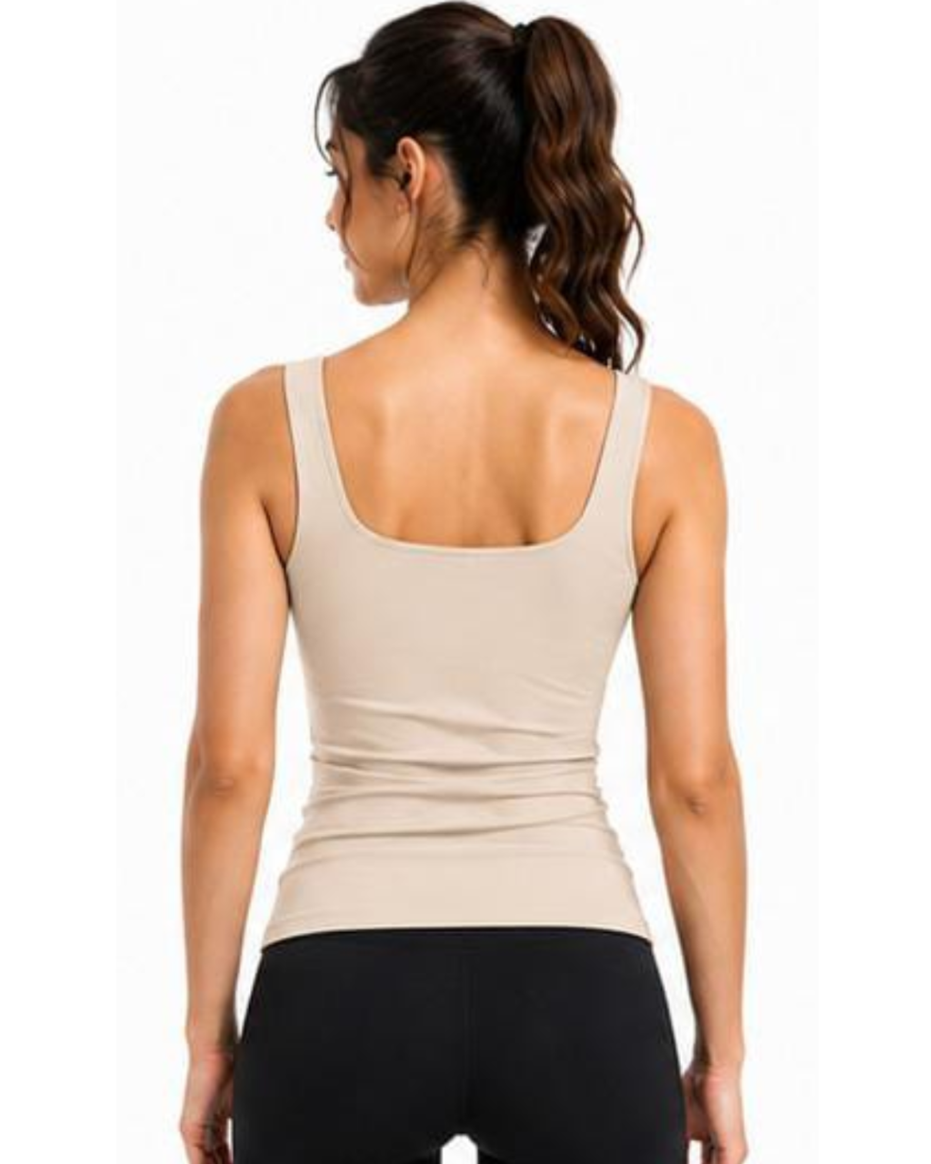 A woman shown from the back wearing a beige scoop-neck tank top and black leggings against a plain white background.