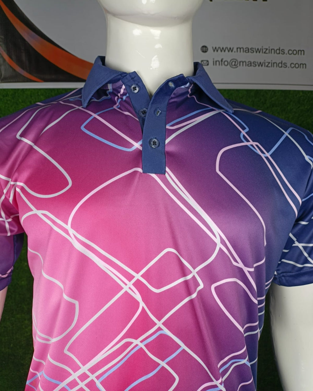 A short-sleeve polo shirt displayed on a white mannequin torso. The shirt features a vibrant gradient transitioning from magenta pink at the bottom to deep purple at the top, overlaid with a white, blue, and purple geometric line pattern.