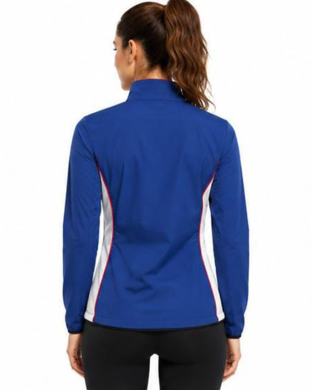 A woman viewed from the back wearing a royal blue athletic zip-up jacket with white and red side panels, paired with black leggings, against a plain white background.