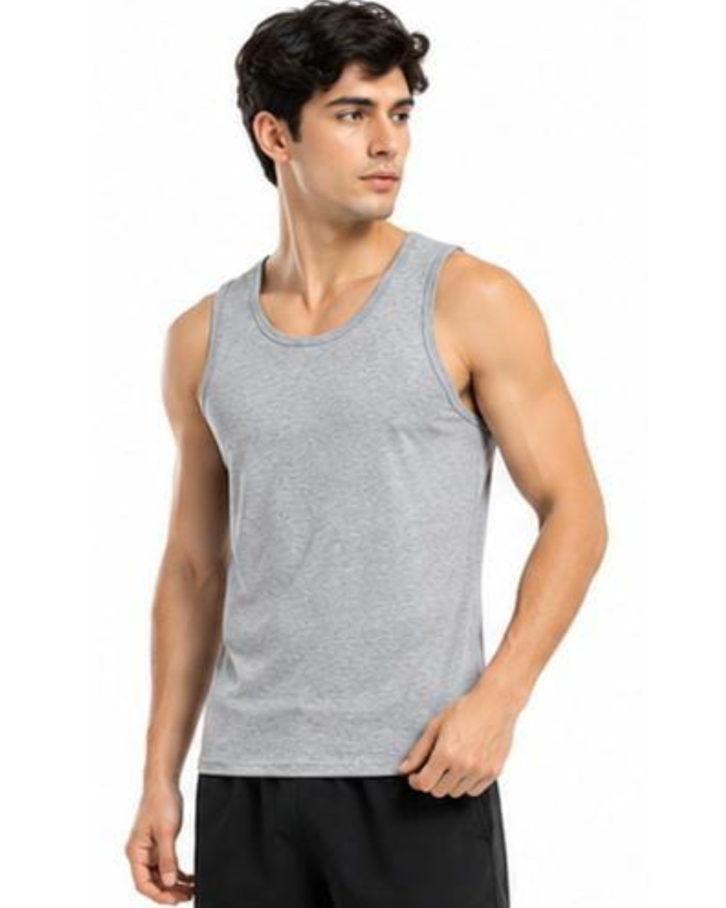 A man wearing a heather gray sleeveless tank top and black shorts, standing against a plain white background.
