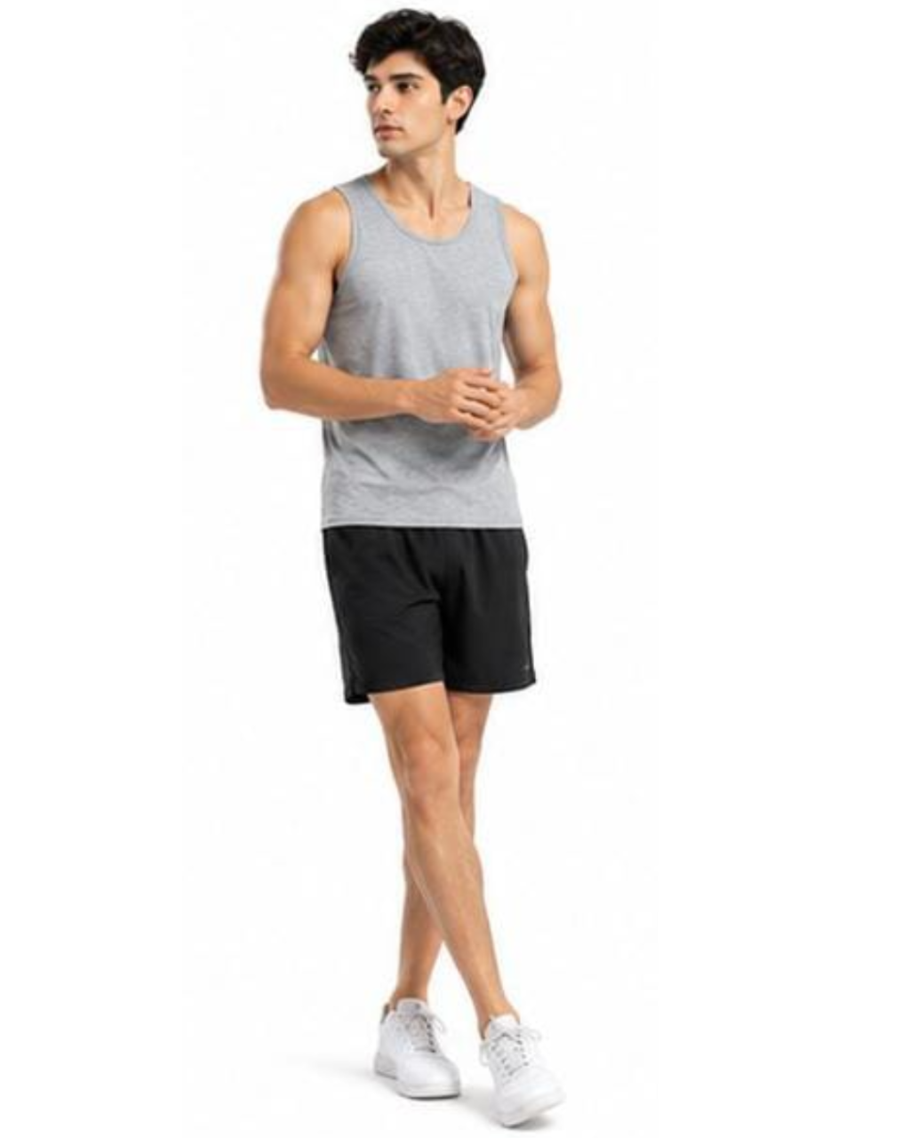 A man modeling a light gray sleeveless tank top and black athletic shorts, paired with white sneakers, against a plain white background.