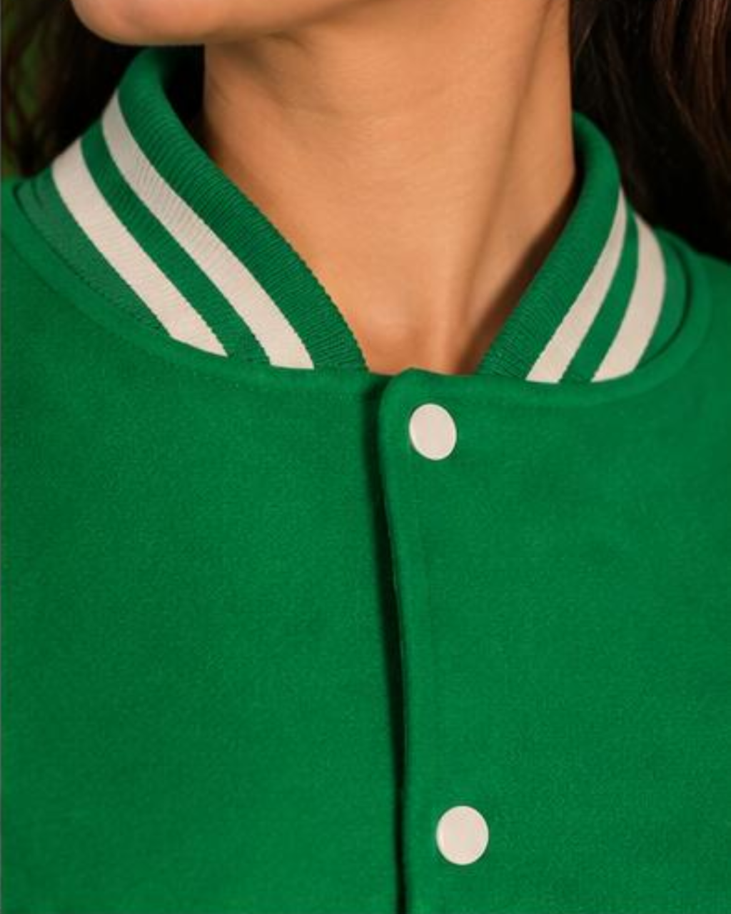 Green varsity jacket with white stripes and buttons