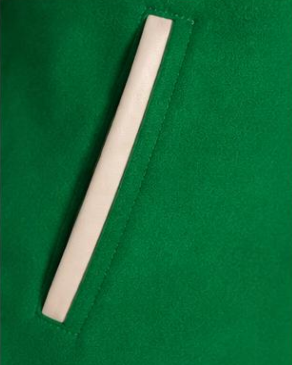 Rectangular white object on a green background