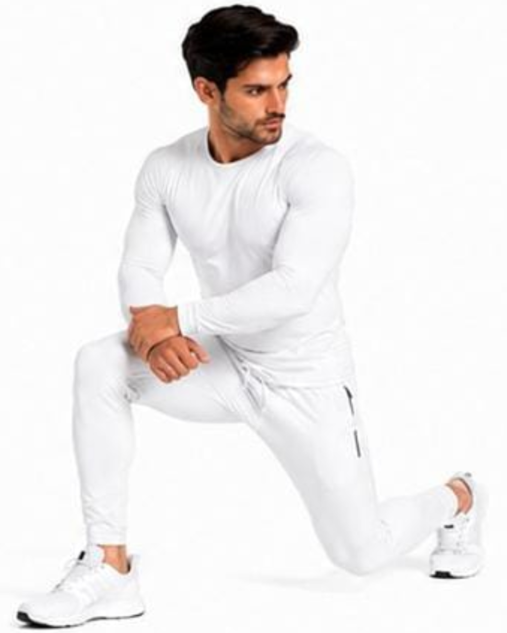 A man in a white long-sleeve athletic shirt and matching white jogger pants, posing in a lunge position against a plain white background.