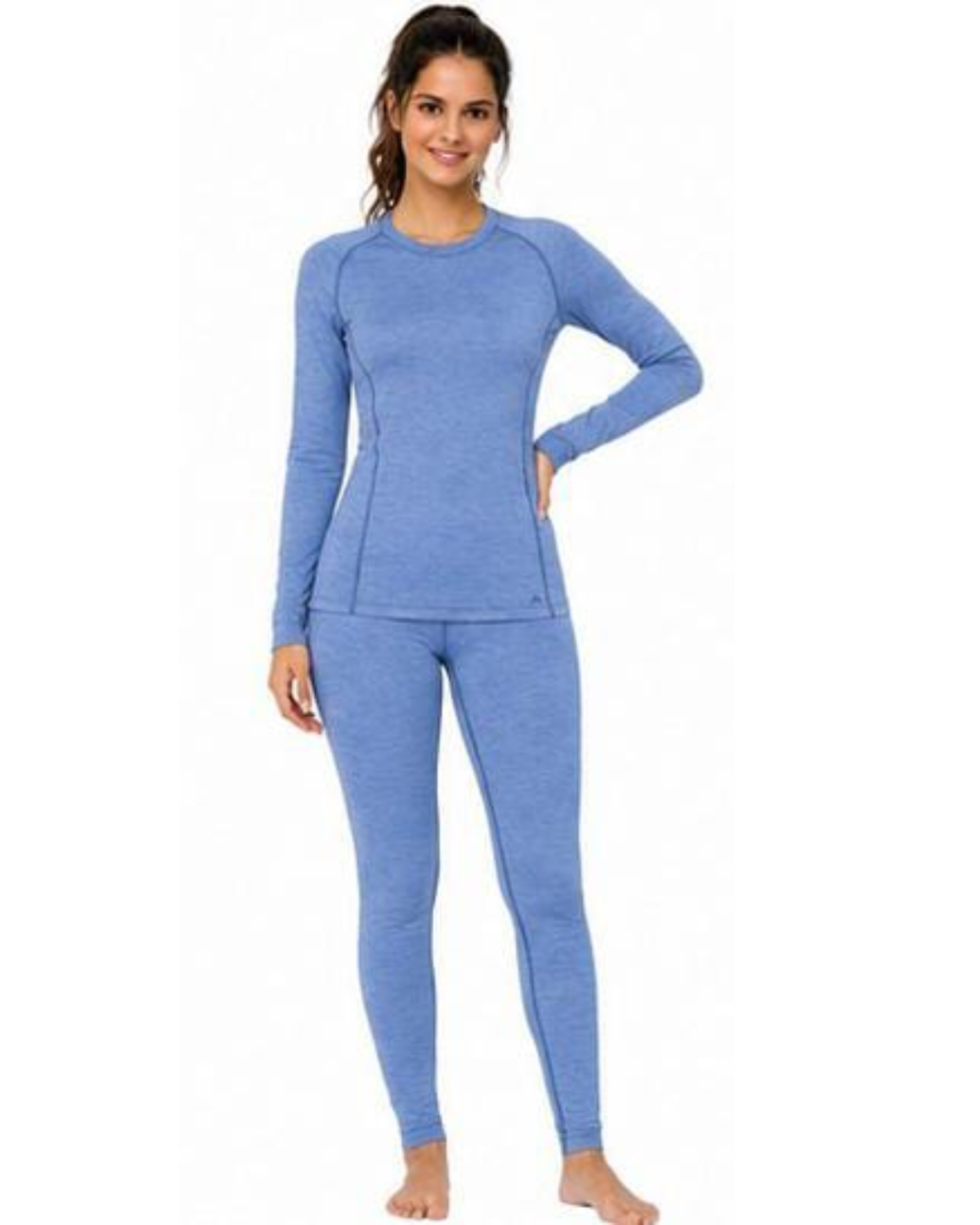 A woman modeling a matching heather blue long-sleeve top and leggings set against a plain white background.