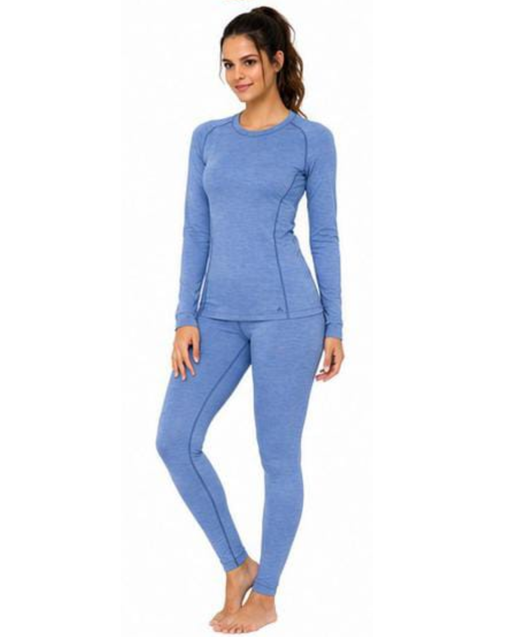 A woman modeling a matching heathered blue long-sleeve top and leggings set against a plain white background.
