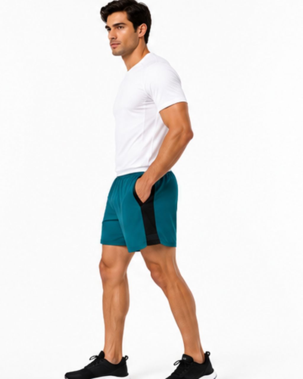 A man in a white t-shirt and teal athletic shorts with a black side panel, standing in profile against a plain white background.