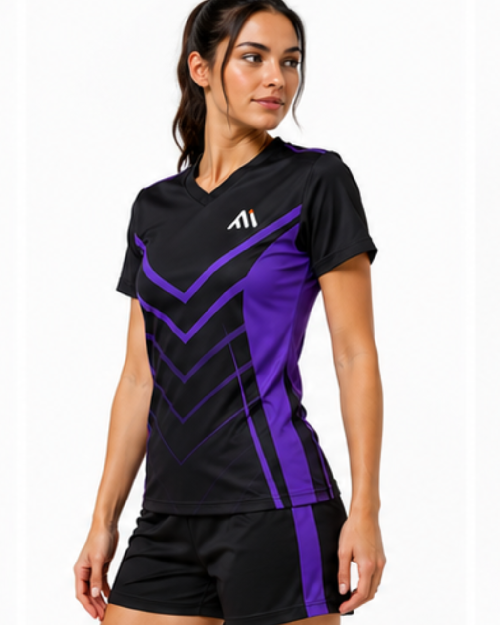 A woman modeling a black athletic V-neck top with purple chevron patterns and a white logo on the chest, paired with black athletic shorts against a plain white background.