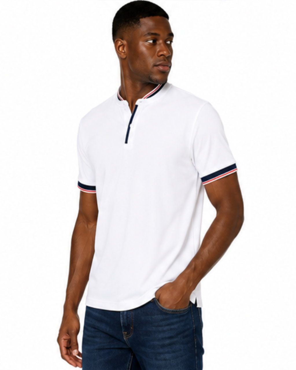 A man wearing a white short-sleeve polo shirt with navy and red striped trim on the collar and cuffs, paired with dark blue jeans, against a plain white background.