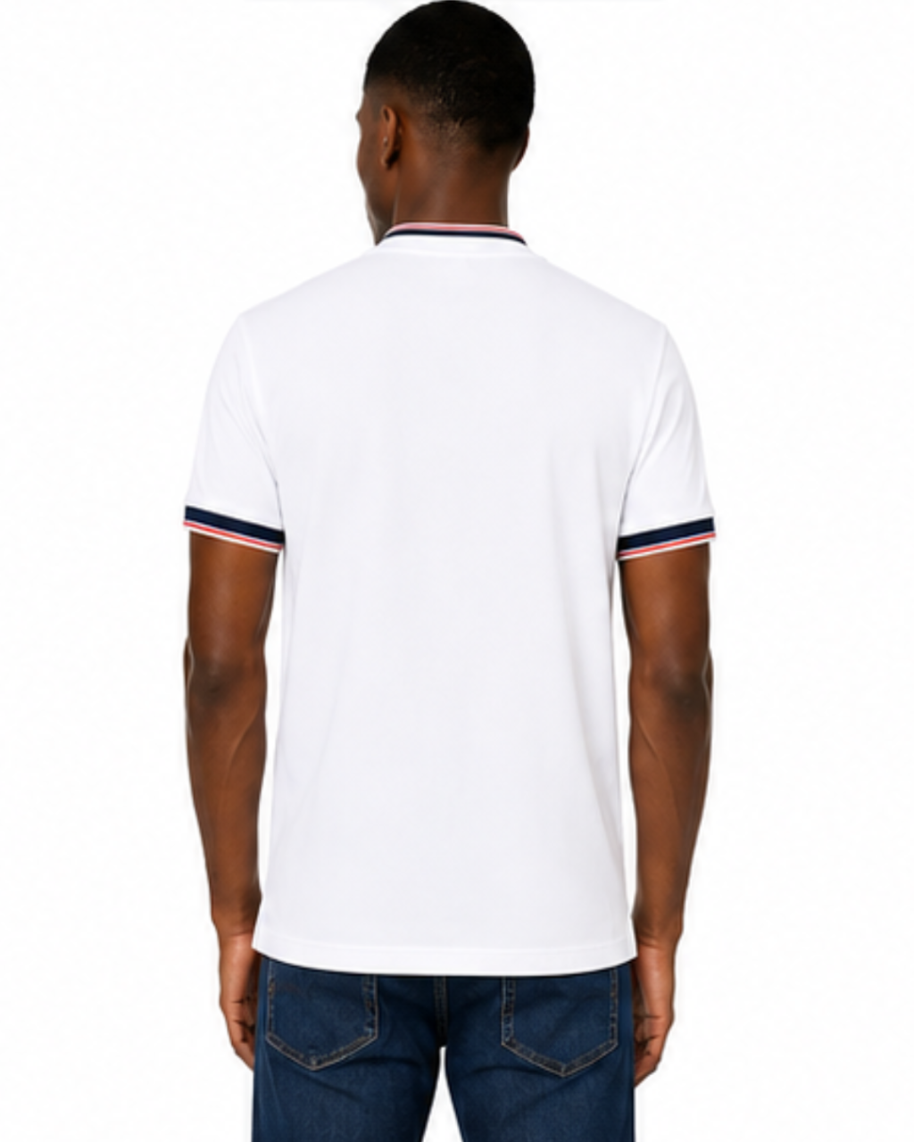 A man viewed from the back wearing a white short-sleeve polo shirt with navy and red striped trim on the collar and sleeve cuffs, paired with blue jeans against a plain white background.