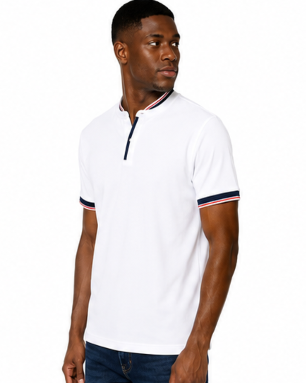 A man wearing a white short-sleeve polo shirt with navy and red striped trim on the collar and sleeve cuffs, paired with dark blue jeans, photographed against a plain white background.